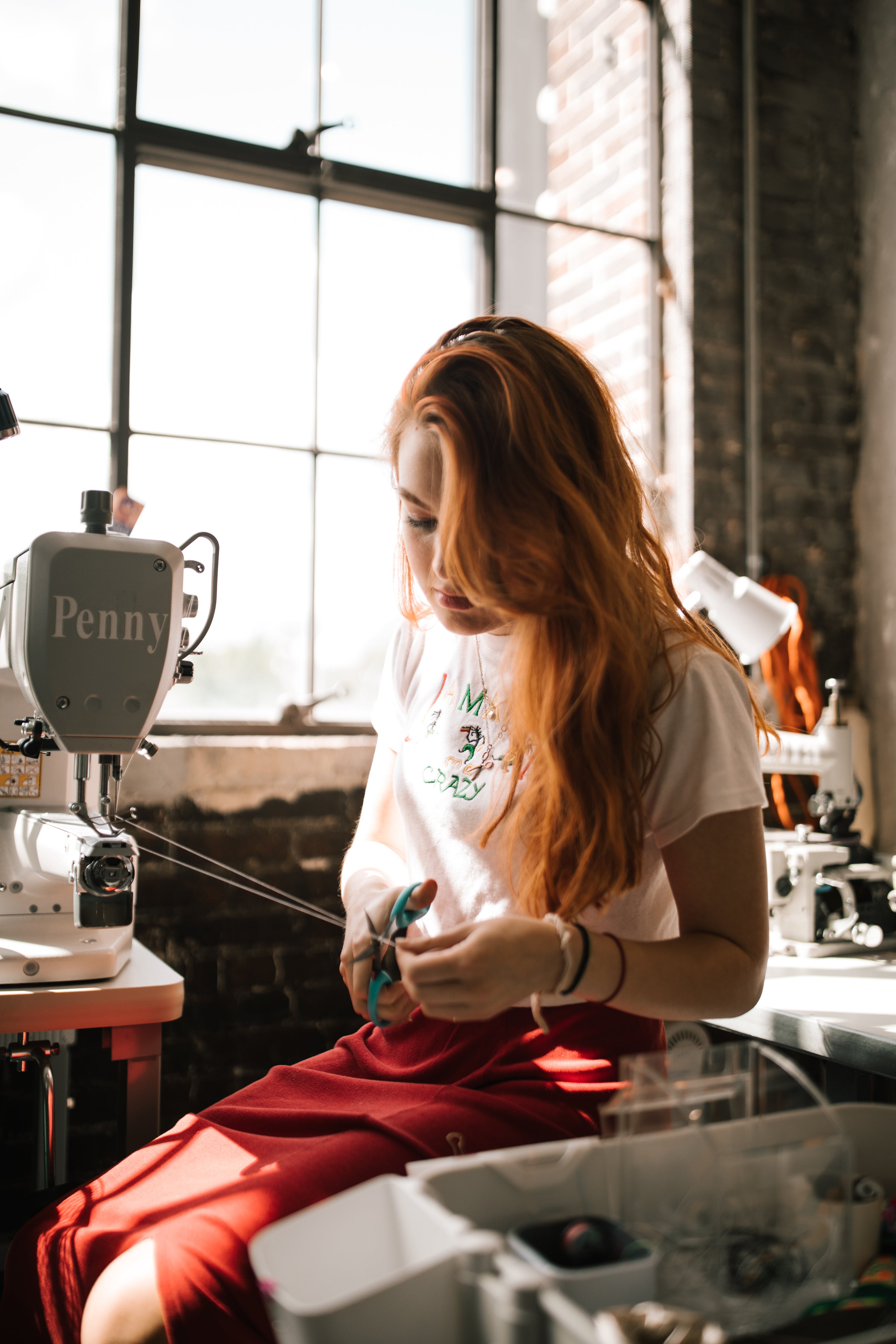 Woman working on sewing machine