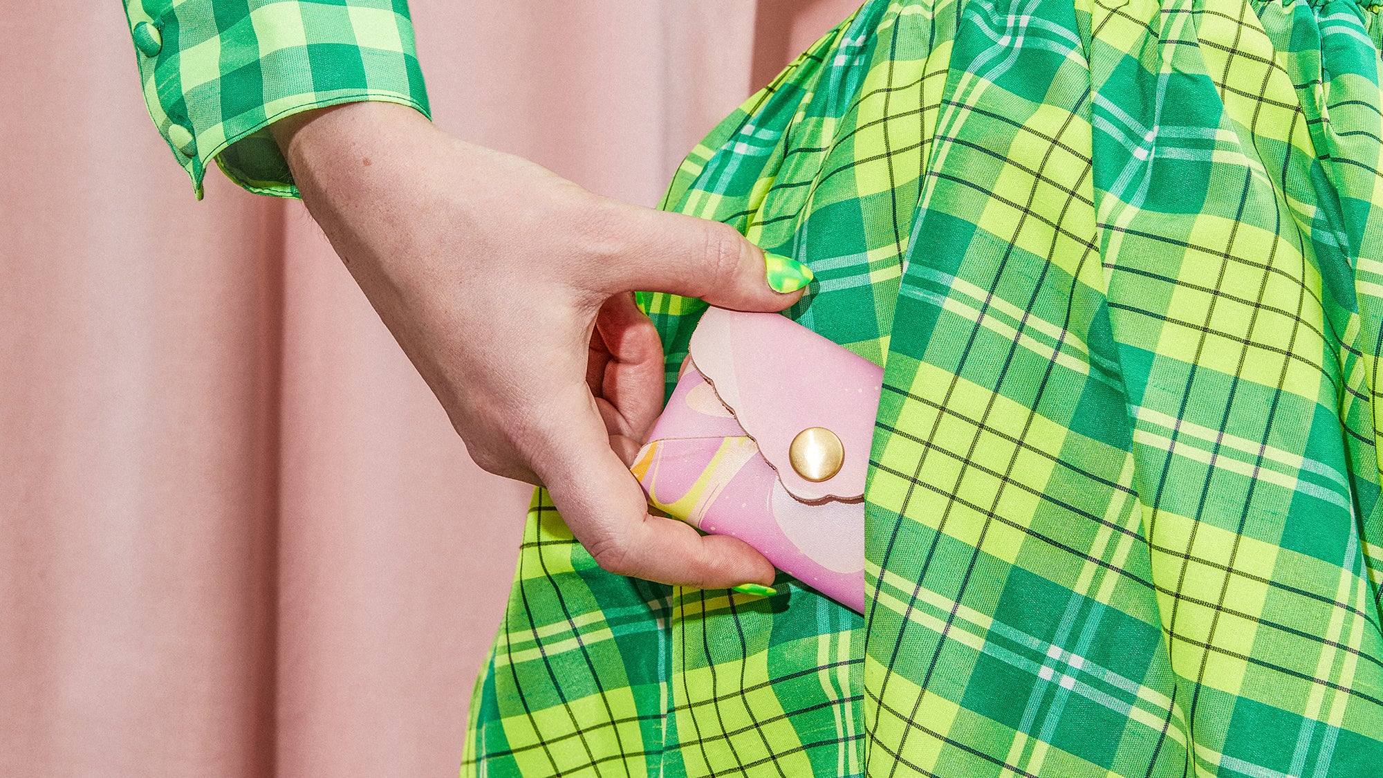 Colorful Leather Wallet - Hand with marbled envelope wallet leaving pocket of green dress 