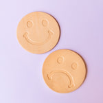 Natural Leather Coasters stamped with smiley face and frowny face
